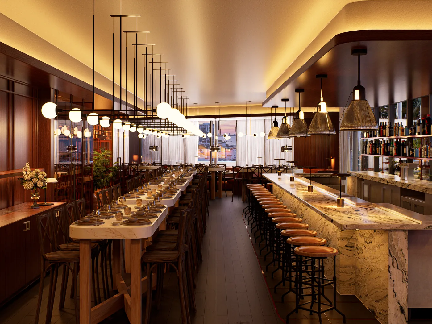 Long restaurant bar with globe pendant lighting and marble counter