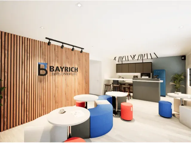 Office breakout lounge with slatted timber wall and soft seating